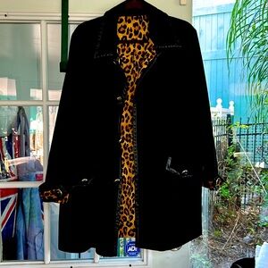 Black women’s reversible coat with leather trim. Mint condition.